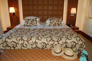 Stylish décor and a huge bed. Oh, and sun hats provided too.