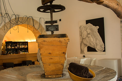 Old olive press in the bar at Son Brull Hotel & Spa