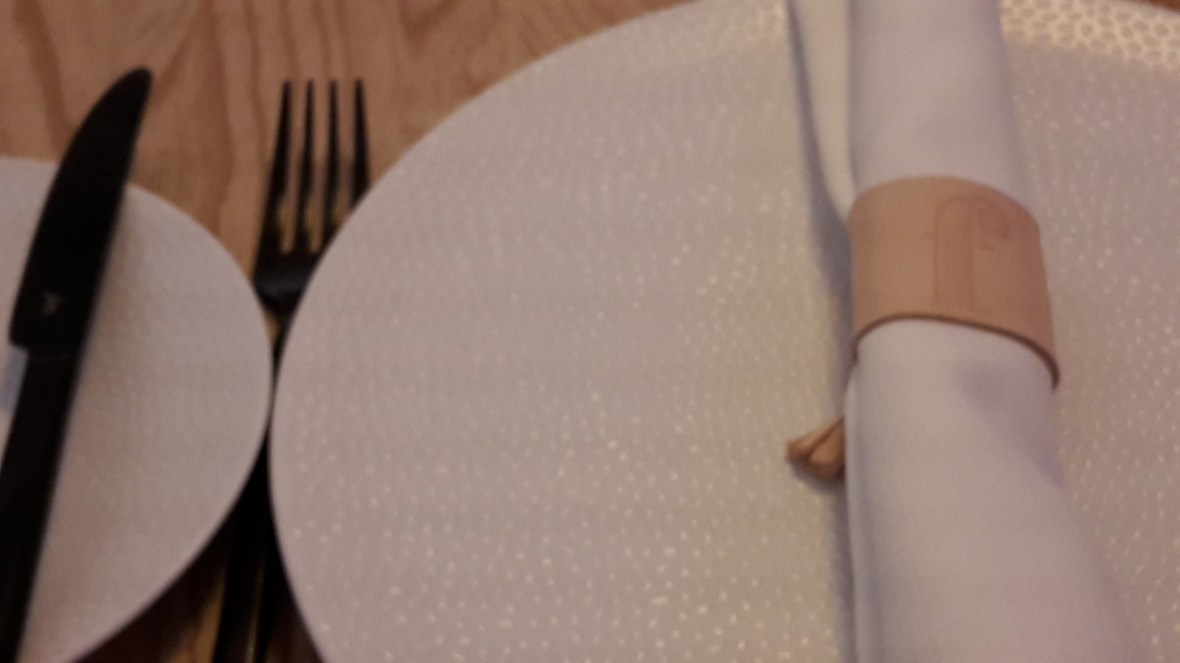 Note the leather napkin ring