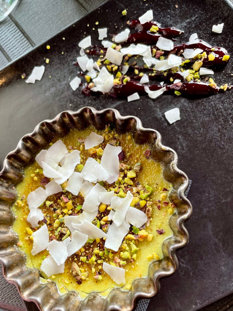 Rich crème brûlée made with matcha and pistachio and topped with coconut flakes. Perfect to share.